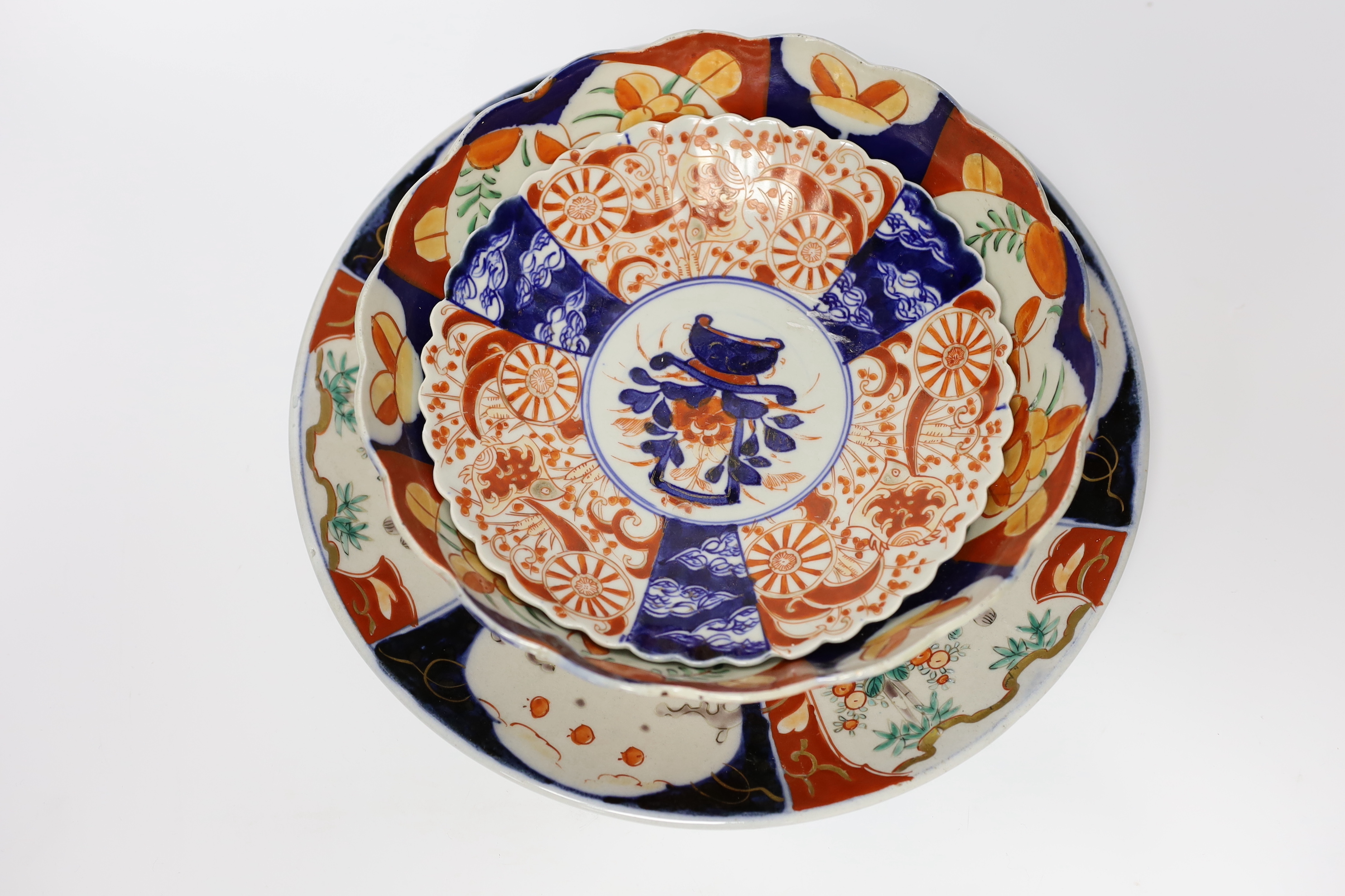 A group of Japanese Imari and kutani together with a Worcester blue and white saucer and a Chinese famille verte teabowl